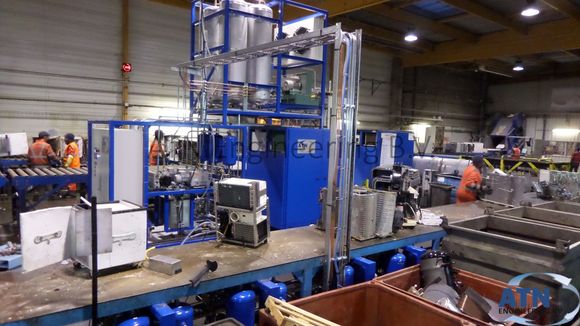 Air-conditioning machine with roller conveyors that carry fridges